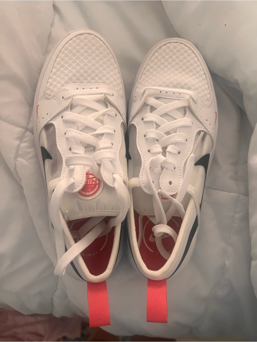 Nike Women’s White Athletic Shoes with Black Swoosh and Pink Accents